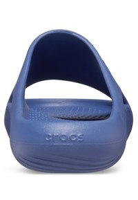 Blue, molded rubber clogs with a rounded back and open heel. Textured sole with small holes for ventilation and "crocs" embossed on the side.