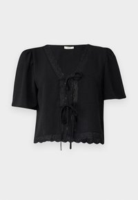Svart kortärmad blus med V-ringning, med ett scallop-mönster i nederkant och ögla-detaljer, knytstängning framtill, tillverkad av lätt tyg.