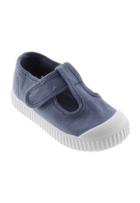 Scarpe Mary Jane in tela di colore blu navy, con punta in gomma bianca e suola testurizzata; cinturino regolabile in velcro per una vestibilità sicura.