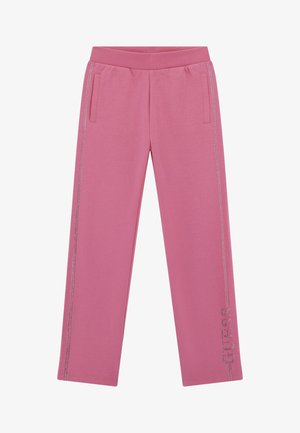 Rozā kokvilnas sporta bikses ar ribotu jostasvietu, sānu kabatām un metāliskām rotājošām detaļām uz kreisā kājas, kuras attēlo zīmola nosaukumu "GUESS."