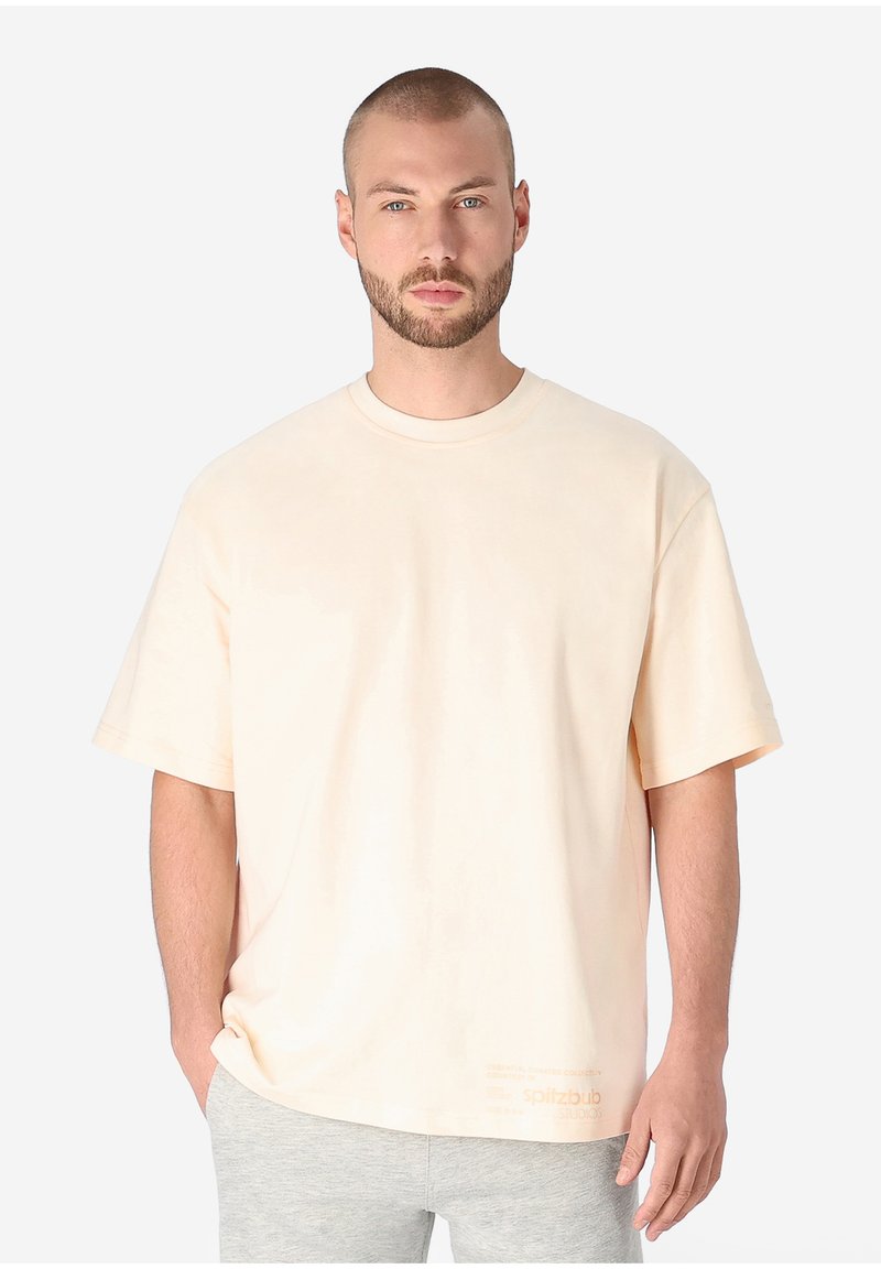 Short-sleeve, crew neck t-shirt in soft beige fabric. Features a relaxed fit and a small logo detail near the hem.