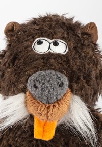 Brown plush toy with a furry texture, large expressive eyes, a gray nose, and white whiskers. Features an orange felt tongue.