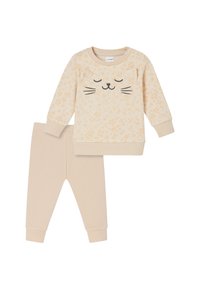 Beige cotton outfit featuring a long-sleeve top with a cat face and spotted pattern, paired with matching solid leggings.