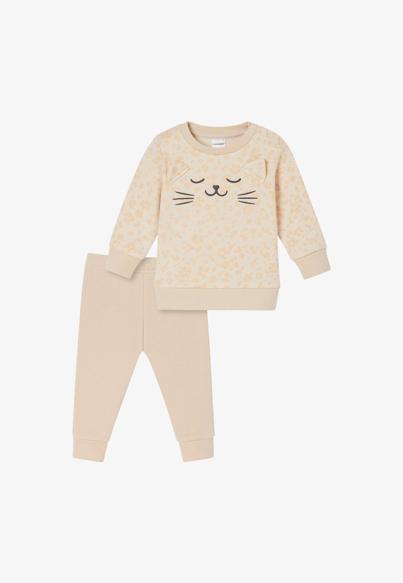 Beiges Baumwoll-Outfit bestehend aus einem Langarmoberteil mit einem Katzen-Gesicht und gepunktetem Muster, kombiniert mit passenden einfarbigen Leggings.