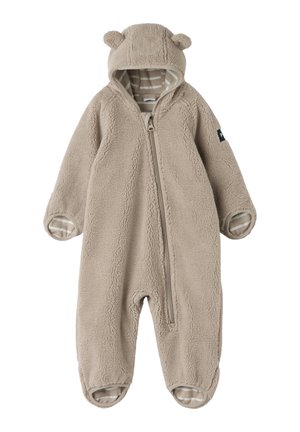 Combinaison bébé en polaire beige douce avec capuche avec oreilles d'ours, fermeture éclair sur le devant et doublure rayée à l'intérieur des poignets et des pieds.