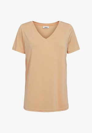 Persikavärvi t-särk, millel on V-kaelus, lühikesed varrukad ja mugav lõige, mis on valmistatud pehmest ja siledast kangast. Tal on diskreetne õmblus ääres.