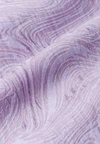 Lilac fabric with a textured pattern resembling wavy lines. Material appears soft with subtle sheen, showcasing intricate detailing throughout.