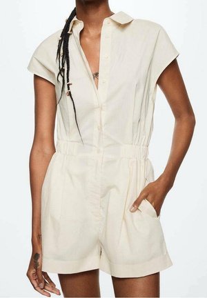 Jupe-pantalon court beige clair avec un col, des manches courtes, des boutons sur le devant, une taille élastique et des poches latérales. En coton, design décontracté.