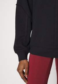 Sweaty Betty Luvtröja - black