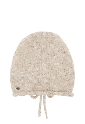 Light beige knitted winter hat with braided ties at the bottom and a small round metal logo on one side.