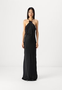 Black satin evening gown with halter neck, gathered bodice, fitted silhouette, and subtle draping to the floor. No visible patterns or hardware.