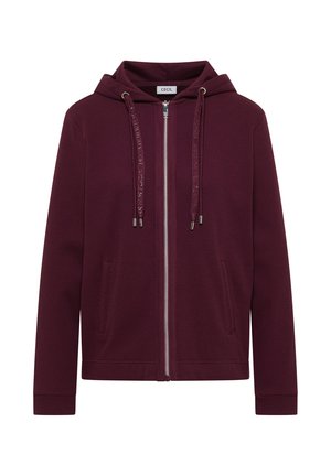 Veste à capuche zippée couleur bordeaux avec tissu texturé, poches avant, cordons de serrage et fermeture éclair argentée visible.