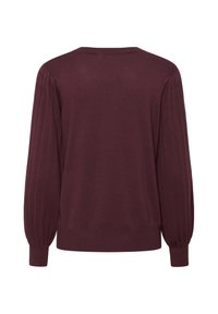 Pull en tricot bordeaux avec des manches ballons côtelées, un décolleté rond et une coupe décontractée. Texture lisse avec un design uni.