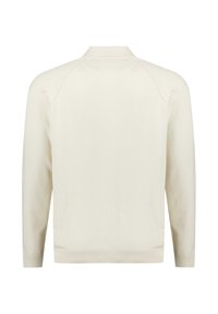 Lichtbeige gebreide trui met een ribgebreide zoom en manchetten, met een minimalistisch ontwerp en raglanmouwen.