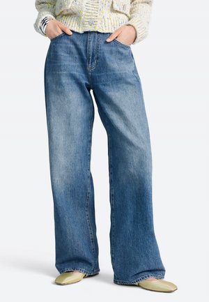 Avar lõikega teksad - denim blue