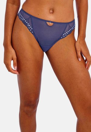 Navyblauwe netpanty met een decoratieve kanten rand, een sleutelgataccent en textuurpatronen langs de tailleband.