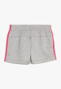 Gray athletic shorts with an elastic waistband, featuring pink side accents and a simple, smooth texture.