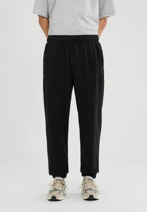 ORVINIO  - Jogginghose - black