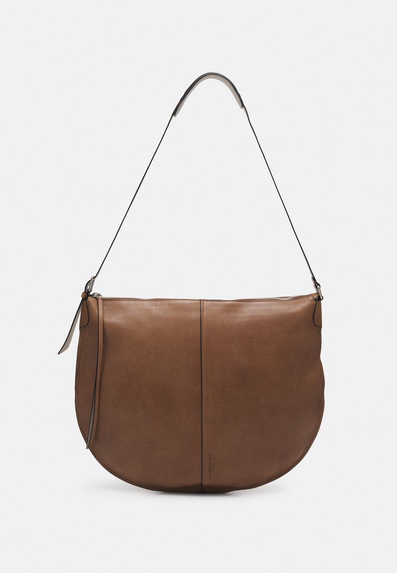 Brown leather shoulder bag with a rounded shape, slim black strap, and minimalistic design. Features a zip closure and sleek stitching.