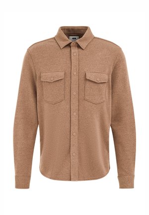 Brūns flaneļa krekls ar pogājamu priekšpusi, divām kabatām un apkakli. Mīksta tekstūra ar garām piedurknēm un noapaļotu malu.