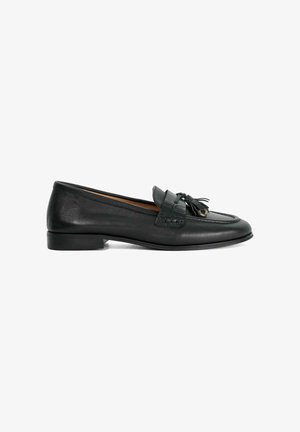 Black leather loafers with a flat heel, rounded toe, decorative tassel detail on the front, and subtle stitching along the edges.