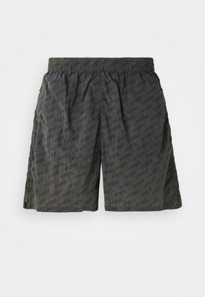 Black shorts with a textured surface, featuring an elastic waistband and a repeated logo pattern. Mid-thigh length with loose fit design.