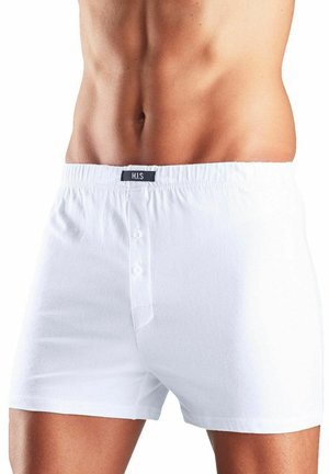 White cotton boxer shorts featuring a soft texture, elastic waistband, and button closure in front. Label visible at the waist.