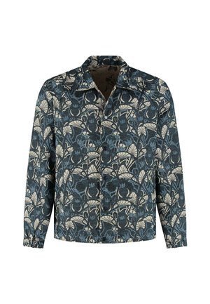 Button-up shirt in dark blue fabric with cream floral pattern. Features a collar, long sleeves, and elastic cuffs. Textured finish.