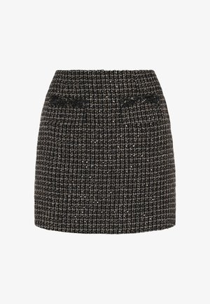 Fekete és arany tweed szoknya texturált mintával, testhezálló fazonnal és közepes derekú szabással. Diszkrét oldalsó zsebekkel és rojtos díszítéssel rendelkezik.