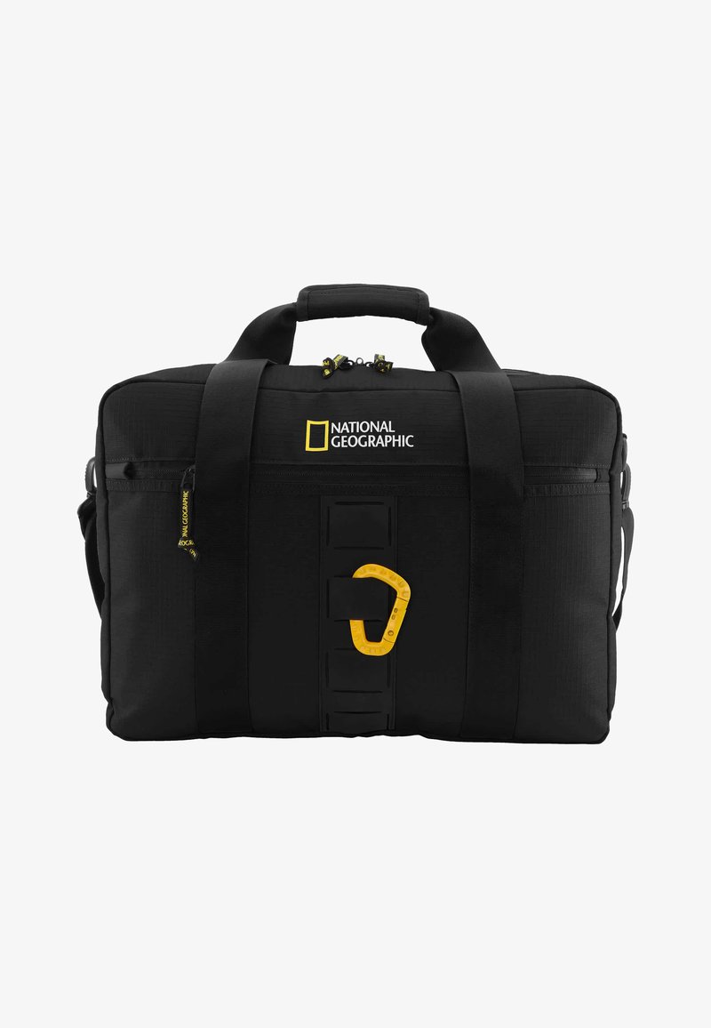 Schwarze Reisetasche mit gepolsterten Griffen, einem gelben Logo und einem gelben Karabiner-Element. Verfügt über ein strukturiertes Gewebe und Reißverschlussfächer.