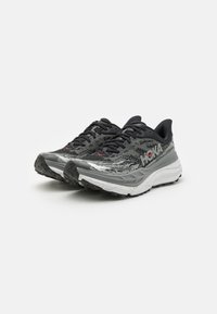 HOKA STINSON 7 - Zapatillas de trail running - black/outer orbit
