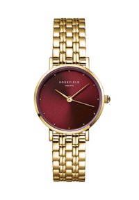 Montre dorée avec un cadran bordeaux, présentant des index horaires simples, un cadran texturé et un bracelet en maillons métalliques. Logo placé à 12 heures.
