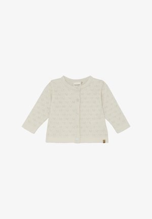 Strikket cardigan i creme med hjerte mønster, knaplukning, rund halsudskæring og lange ærmer. Indeholder et lille logomærke nederst.