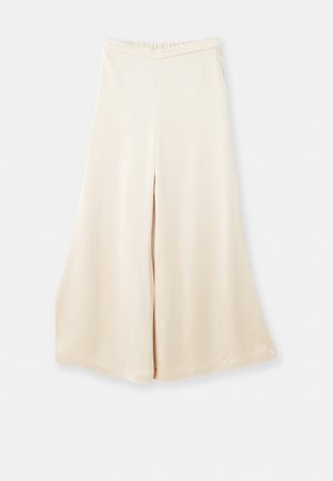 Beige weit geschnittene Hosen aus glattem Stoff mit hohem Bund und weichem Fall. Sie haben eine lockere Passform und klare, schlichte Linien.