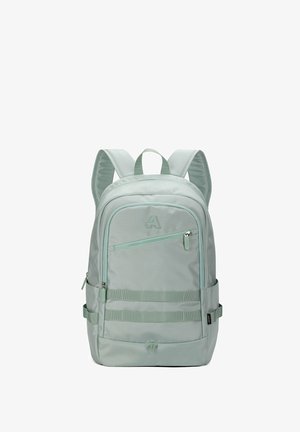 Light green backpack with padded straps, front zip pocket, side pockets, and horizontal loops on front panel for attachments.