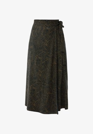 Jupe portefeuille avec un motif géométrique rayé noir et beige, nouée à la taille avec une ceinture en tissu, de longueur genou à mi-mollet.