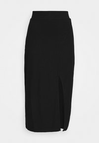 Svart ribbad stickad kjol med hög midja, med en hög slits på ena sidan. Mjuk textur och strömlinjeformad siluett.