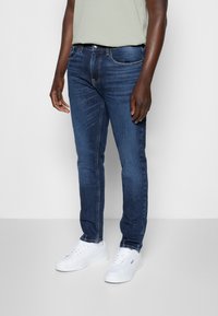 Tommy Jeans Jeans Tapered Fit - dark-blue denim
