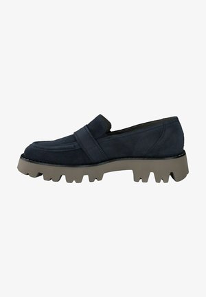 Navy blue suede slip-on shoe with a ridged gray rubber sole, featuring a broad strap across the upper and rounded toe design.