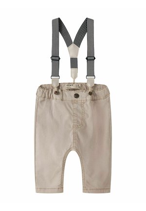 Béžové detské nohavice s elastickým pásom a čiernobielymi pruhovanými trakovými popruhmi pripojenými gombíkmi.