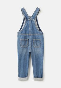 Denim kombinezoni u srednje plavoj boji sa podesivim trakama, dva prednja džepa i dva zadnja džepa. Manžetne su podvrnute s laganom sivoj obodom.