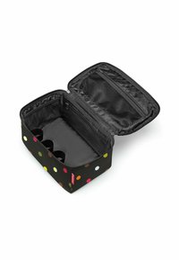 Schwarze Aufbewahrungstasche mit Polka-Dots und Reißverschluss, ausgestattet mit einer Netztasche und drei Fächern für die Organisation im Inneren.