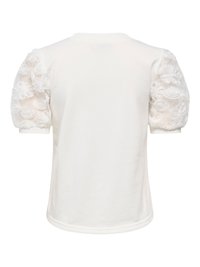 Blouse blanche à manches courtes avec manches bouffantes en voile transparent ornées de broderies florales 3D, vue de dos.