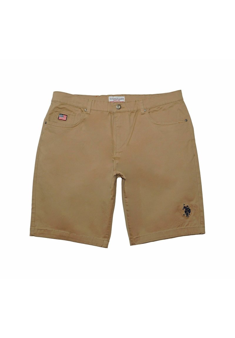 Tan shorts made of cotton with a straight cut. Features a small American flag patch on the left pocket and an embroidered logo on the right leg.