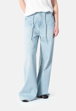 Light blue wide-leg jeans with drawstring waist, featuring a relaxed fit, smooth denim texture, and subtle fading.