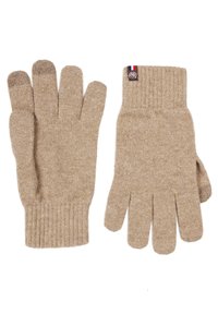 Gants en laine beige avec un poignet côtelé, dotés de cinq doigts, d'une finition texturée et d'une petite étiquette avec un accent rouge, blanc et bleu.