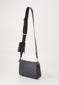 Black leather crossbody bag with embossed pattern, gold hardware, and adjustable strap. Includes a matching mini pouch attached to the strap.