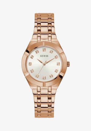 Orologio in metallo rosa con quadrante rotondo, faccia argentata e cristalli come indicatori delle ore. Bracciale a maglie con cinturino ottagonale.