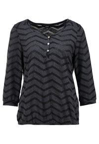 Svart och grå långärmad tröja med ett chevronmönster, V-ringning, tre knappar och en något gathered fåll. Mjuk tygkänsla.