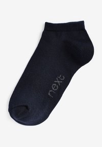 Chaussette à cheville bleu marine foncé en tissu côtelé, avec un renfort au niveau des orteils et du talon. Sur le côté, le mot "next" est affiché en gris clair.
